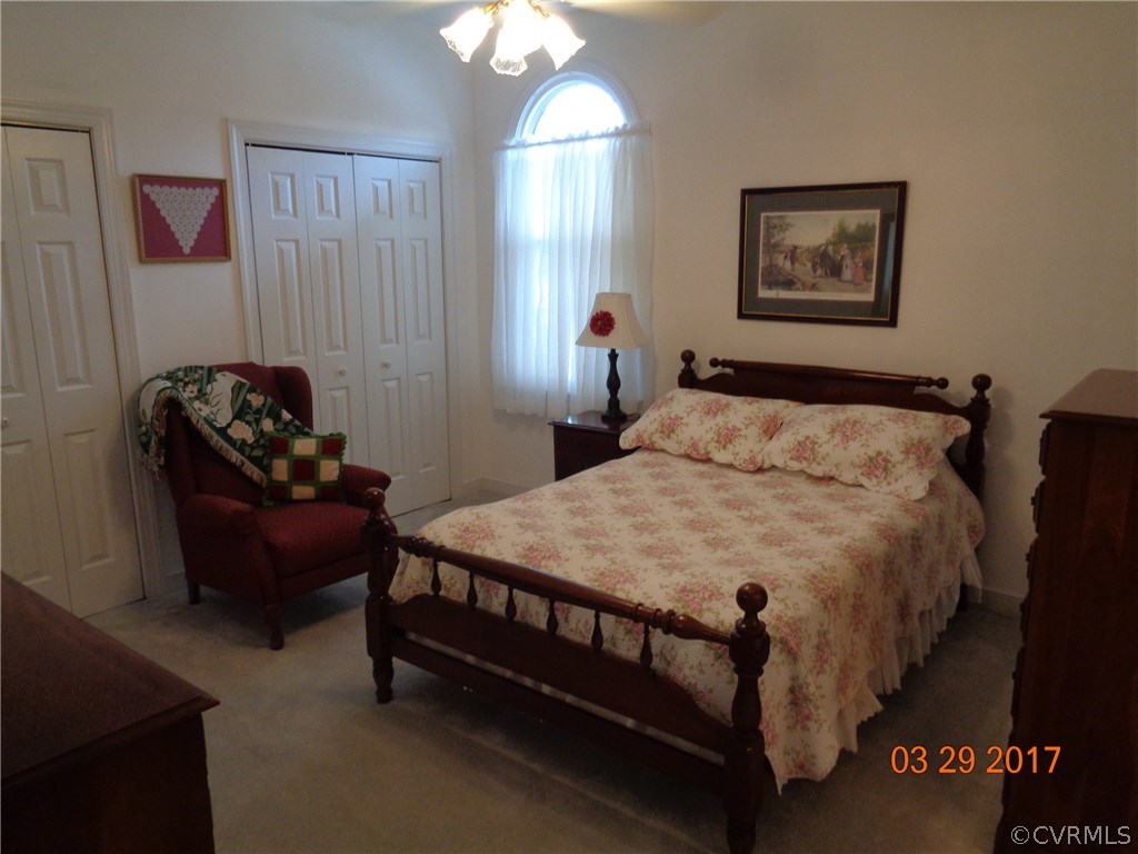 13018 Chipstead Road Chester, VA 23831 - Photo 35 of 47 a bedroom with a bed mirror and window