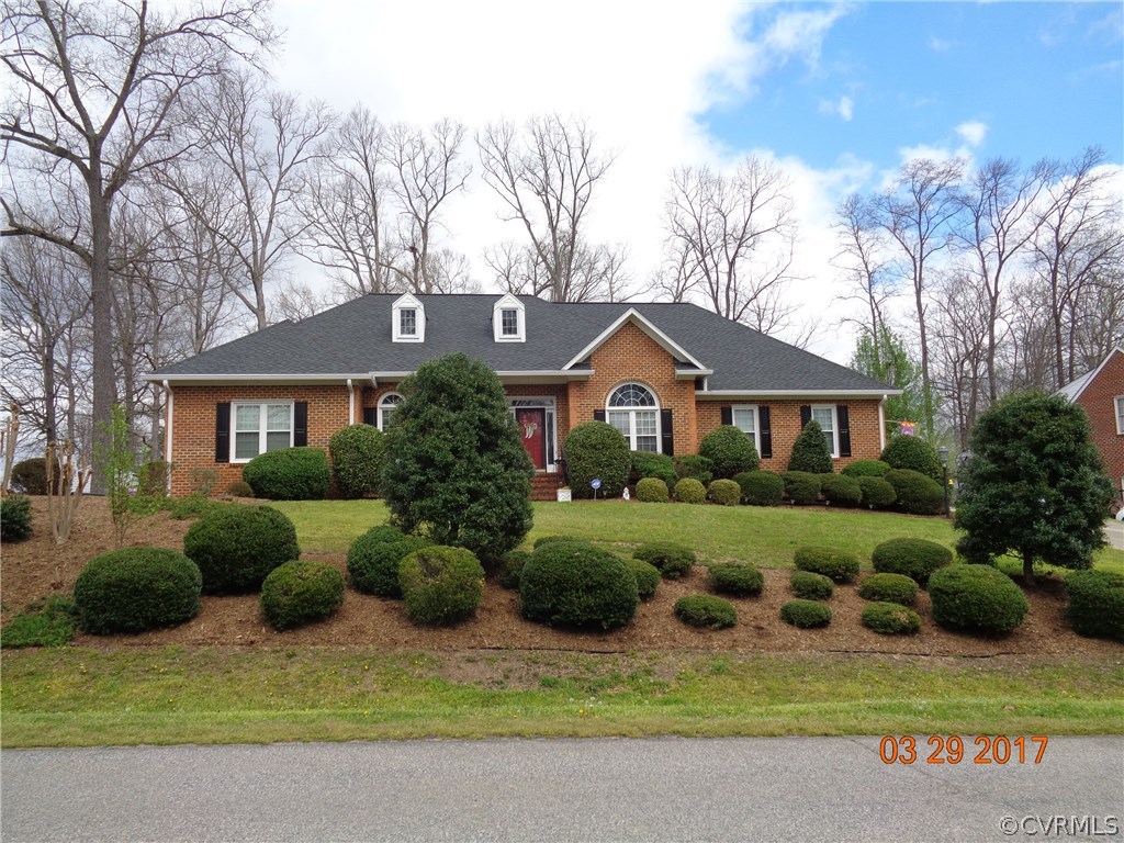 13018 Chipstead Road Chester, VA 23831 - Photo 4 of 47 a front view of a house with garden