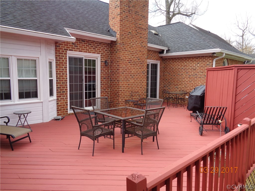 13018 Chipstead Road Chester, VA 23831 - Photo 43 of 47 a backyard of a house with table and chairs