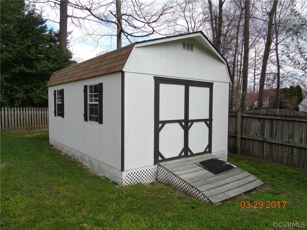 13018 Chipstead Road Chester, VA 23831 - Photo 45 of 47 a front view of a house with garden