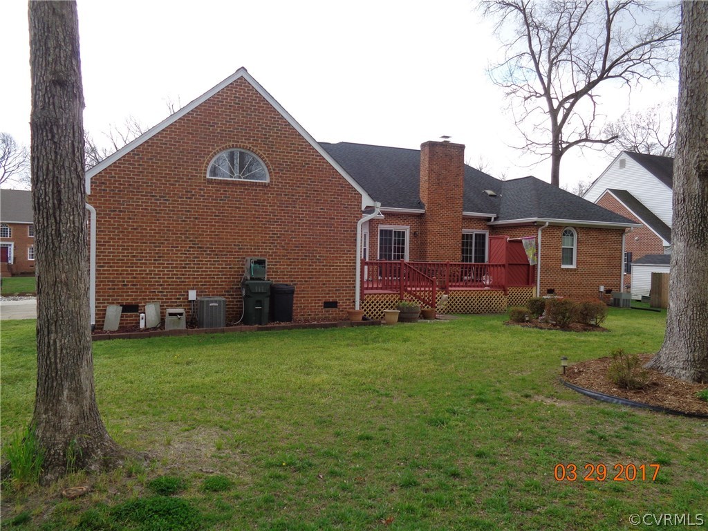 13018 Chipstead Road Chester, VA 23831 - Photo 8 of 47 a view of a house with a backyard