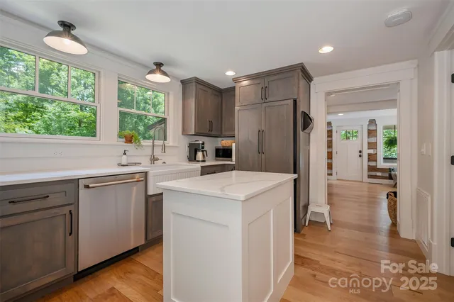 a kitchen with a stove and cabinets