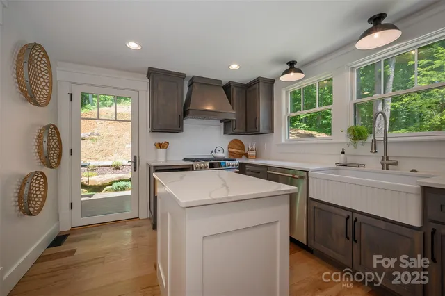 a bathroom with a toilet sink vanity and mirror