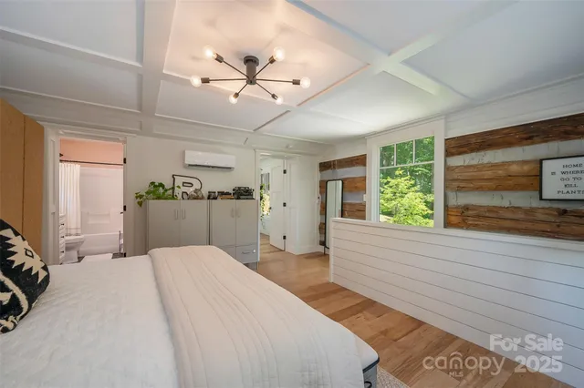 a bedroom with bed and a window