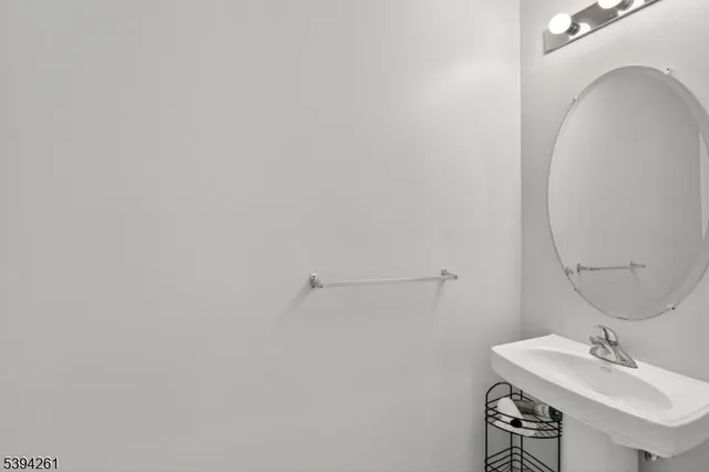 a bathroom with a sink and mirror