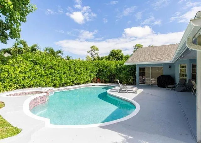 a view of a swimming pool with a patio