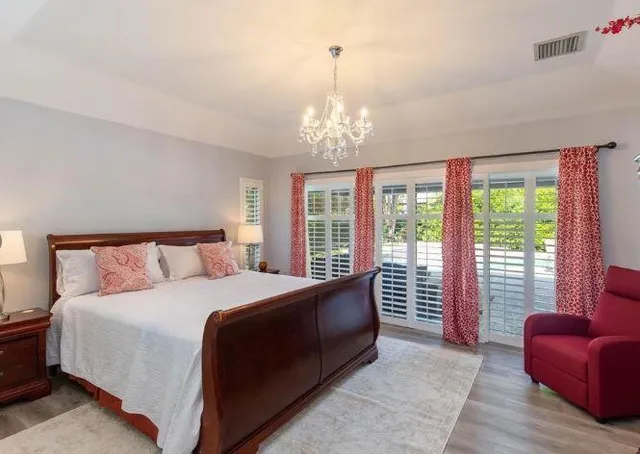 a bedroom with a large bed and a couch