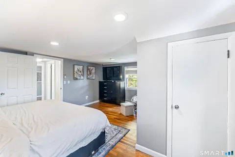 a bedroom with a bed and a view of bathroom