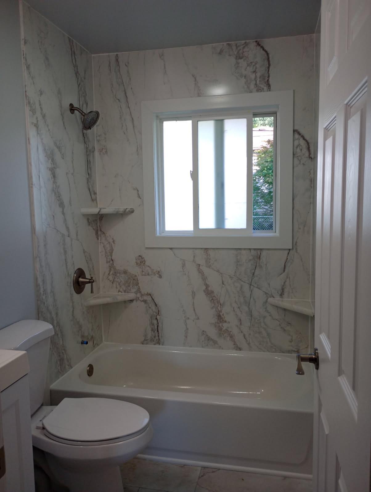 2375 Arrow Street Portage, IN 46368 - Photo 7 of 13 a bathroom with a toilet and a bathtub