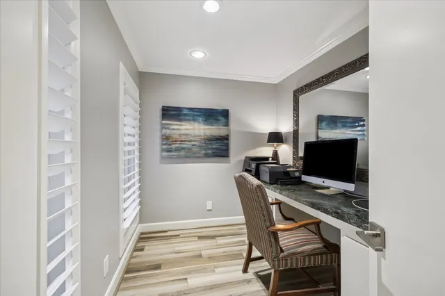 a workspace with furniture and a window