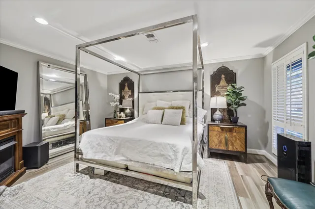 a bedroom with a bed and a mirror