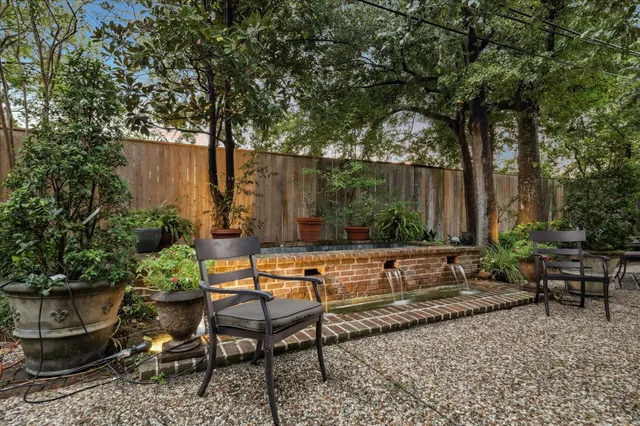 a view of a backyard with sitting area