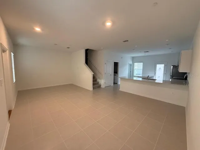 a view of a livingroom with furniture and a flat screen tv
