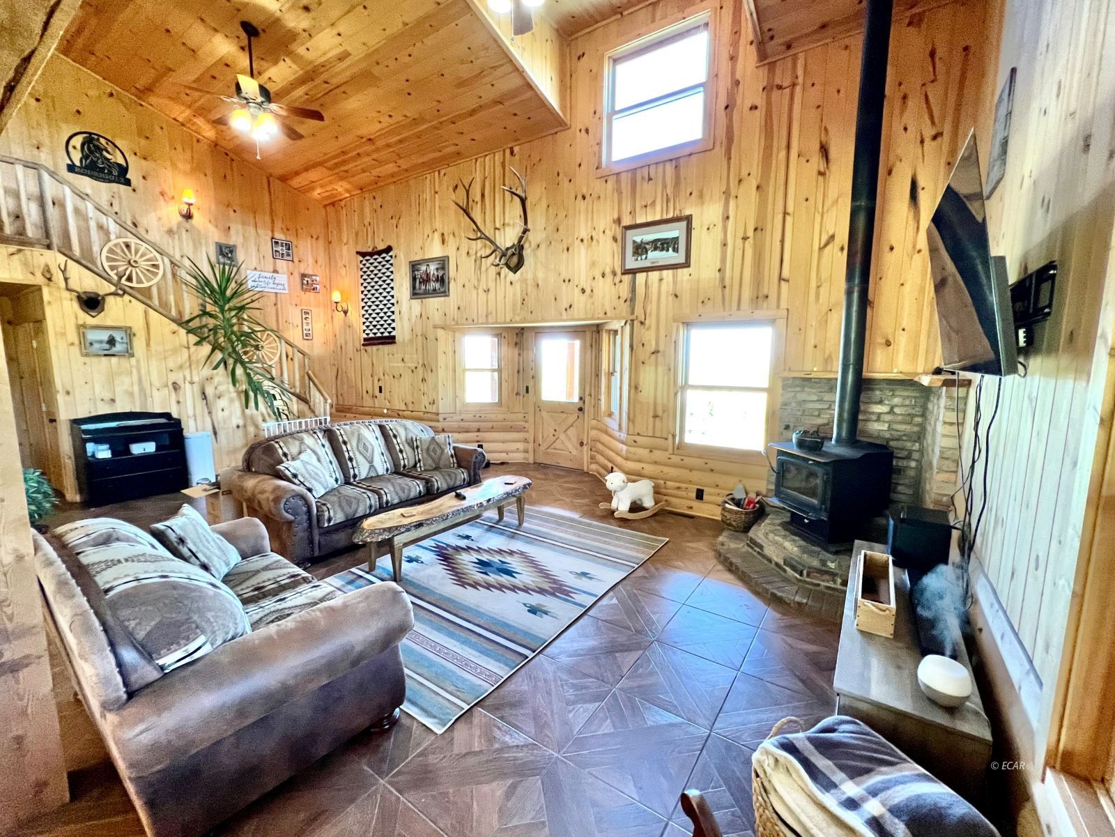 4513 Starr Valley Road Deeth, NV 89823 - Photo 3 of 49 a living room with furniture and a flat screen tv