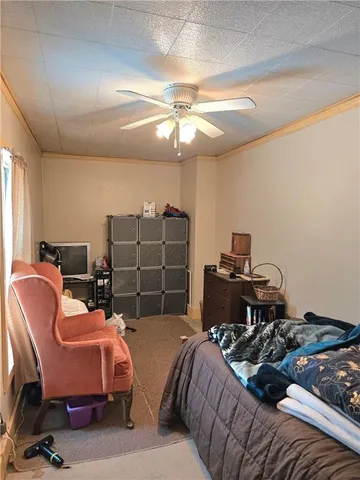 a bed room with a bed and a chair