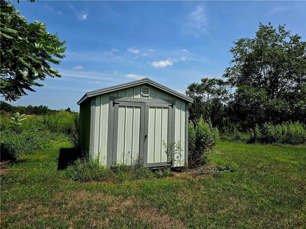 609 Trout Run Road Punxsutawney, PA 15767 - Photo 30 of 34 a view of a backyard with plants and large trees