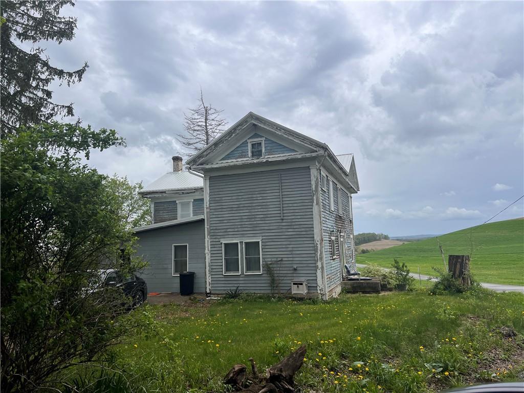 609 Trout Run Road Punxsutawney, PA 15767 - Photo 3 of 34 a front view of a house with a garden