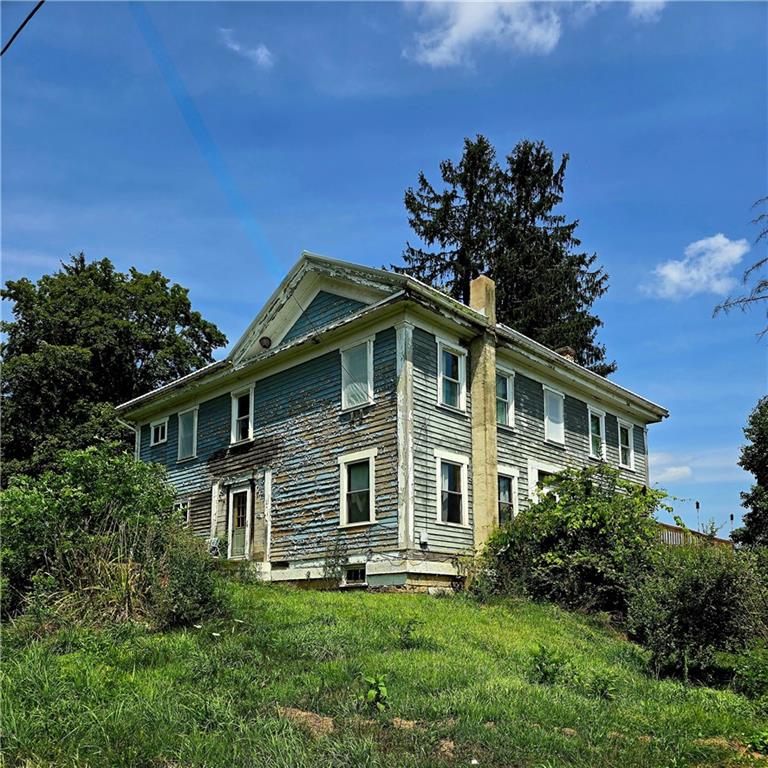 609 Trout Run Road Punxsutawney, PA 15767 - Photo 4 of 34 a front view of a house with a yard