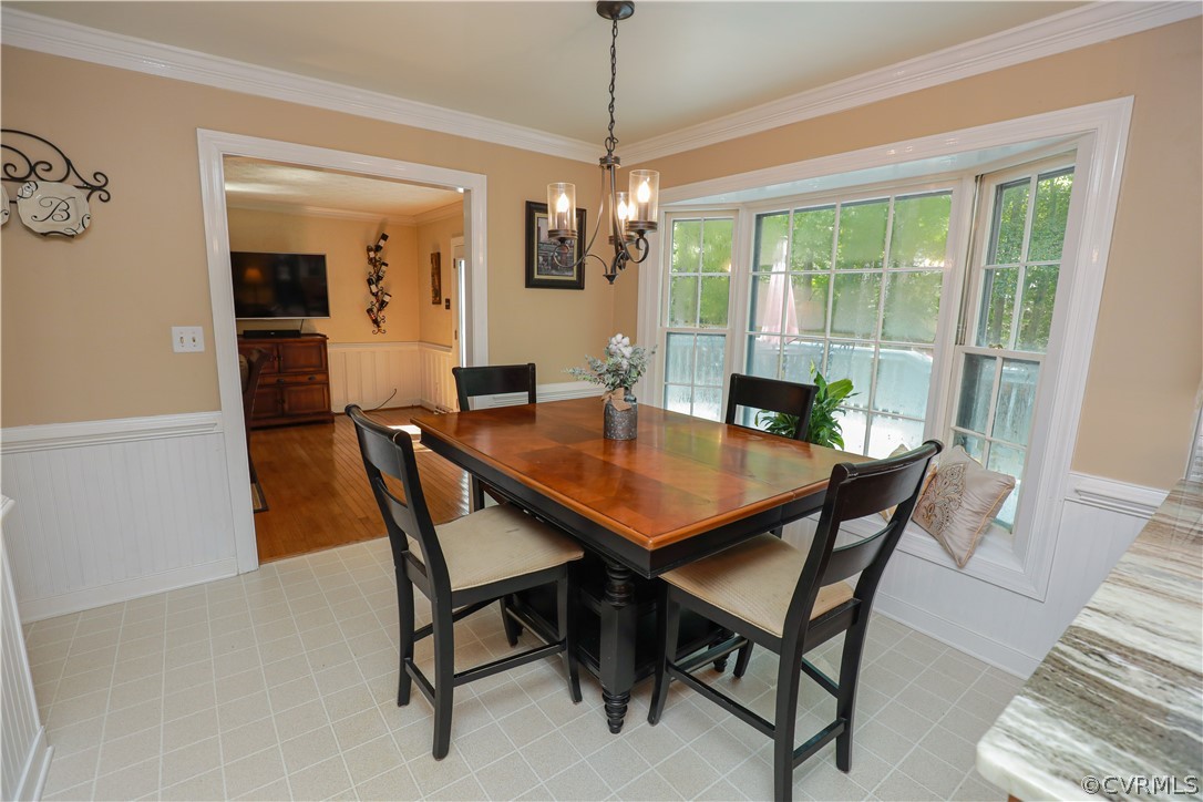 13619 Winterberry Ridge Midlothian, VA 23112 - Photo 11 of 48 a view of a dining room with furniture window and wooden floor