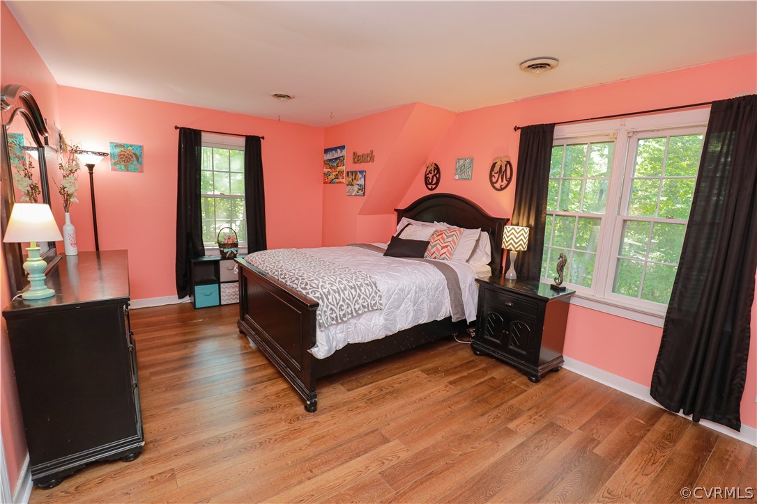 13619 Winterberry Ridge Midlothian, VA 23112 - Photo 33 of 48 a spacious bedroom with a bed and a dresser next to a window