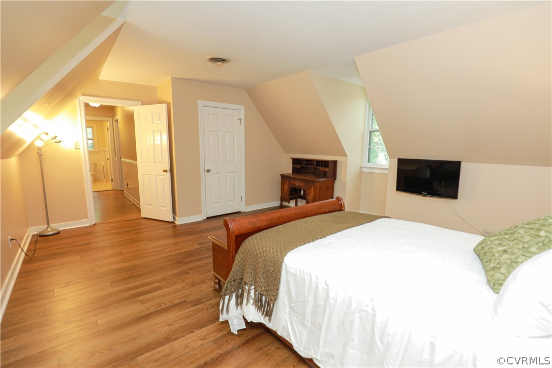 13619 Winterberry Ridge Midlothian, VA 23112 - Photo 35 of 48 a bedroom with a bed and wooden floor