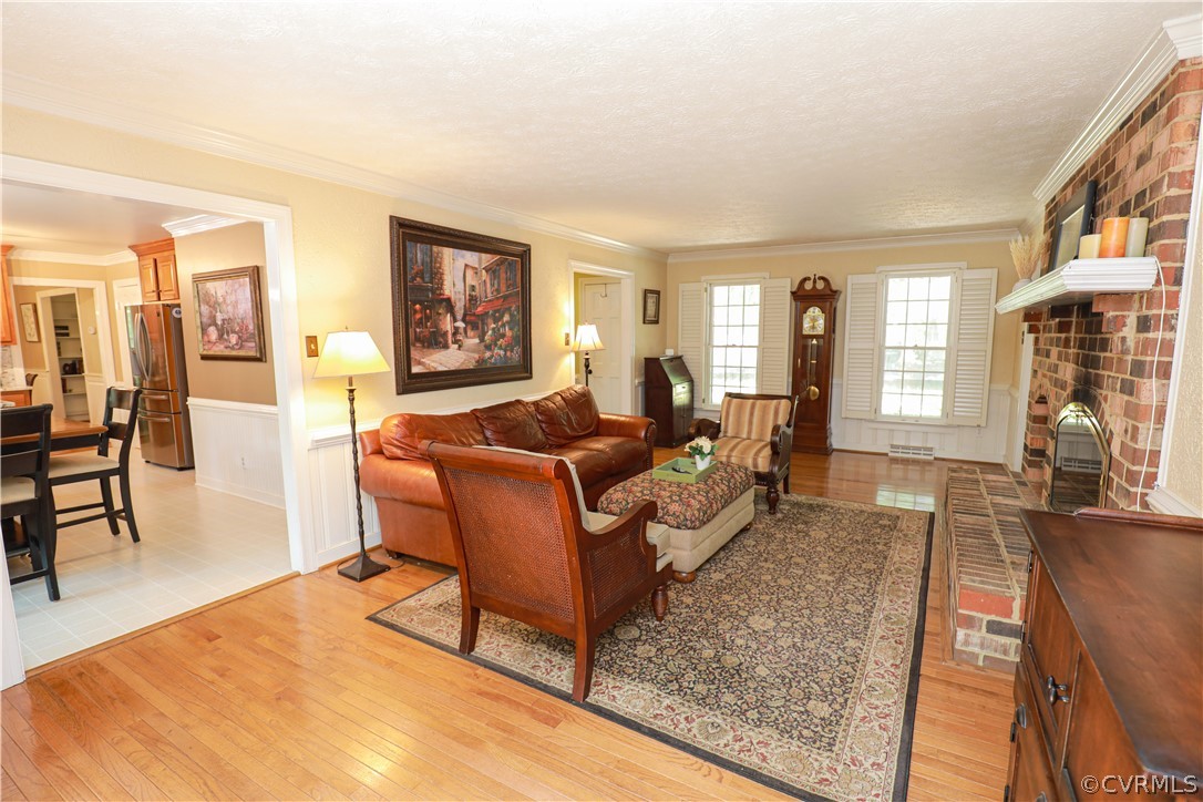 13619 Winterberry Ridge Midlothian, VA 23112 - Photo 7 of 48 a living room with furniture and a wooden floor