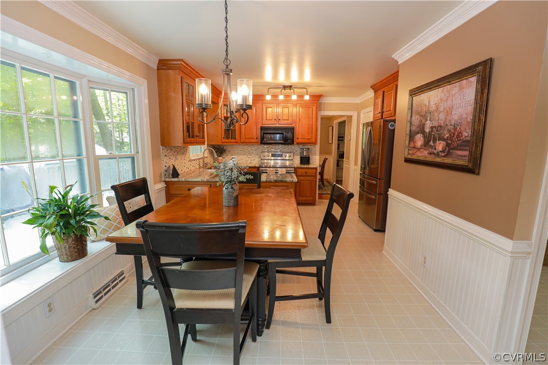 13619 Winterberry Ridge Midlothian, VA 23112 - Photo 9 of 48 a view of a dining room with furniture window and wooden floor