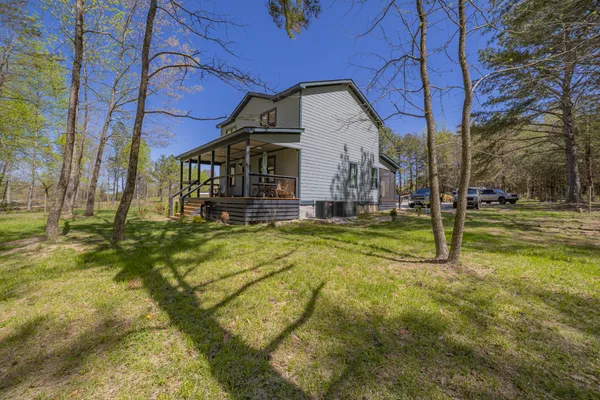 a view of a house with basketball court