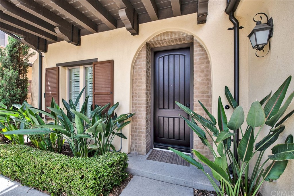 23 White Sage Irvine, CA 92618 - Photo 2 of 5 a front view of house with small garden