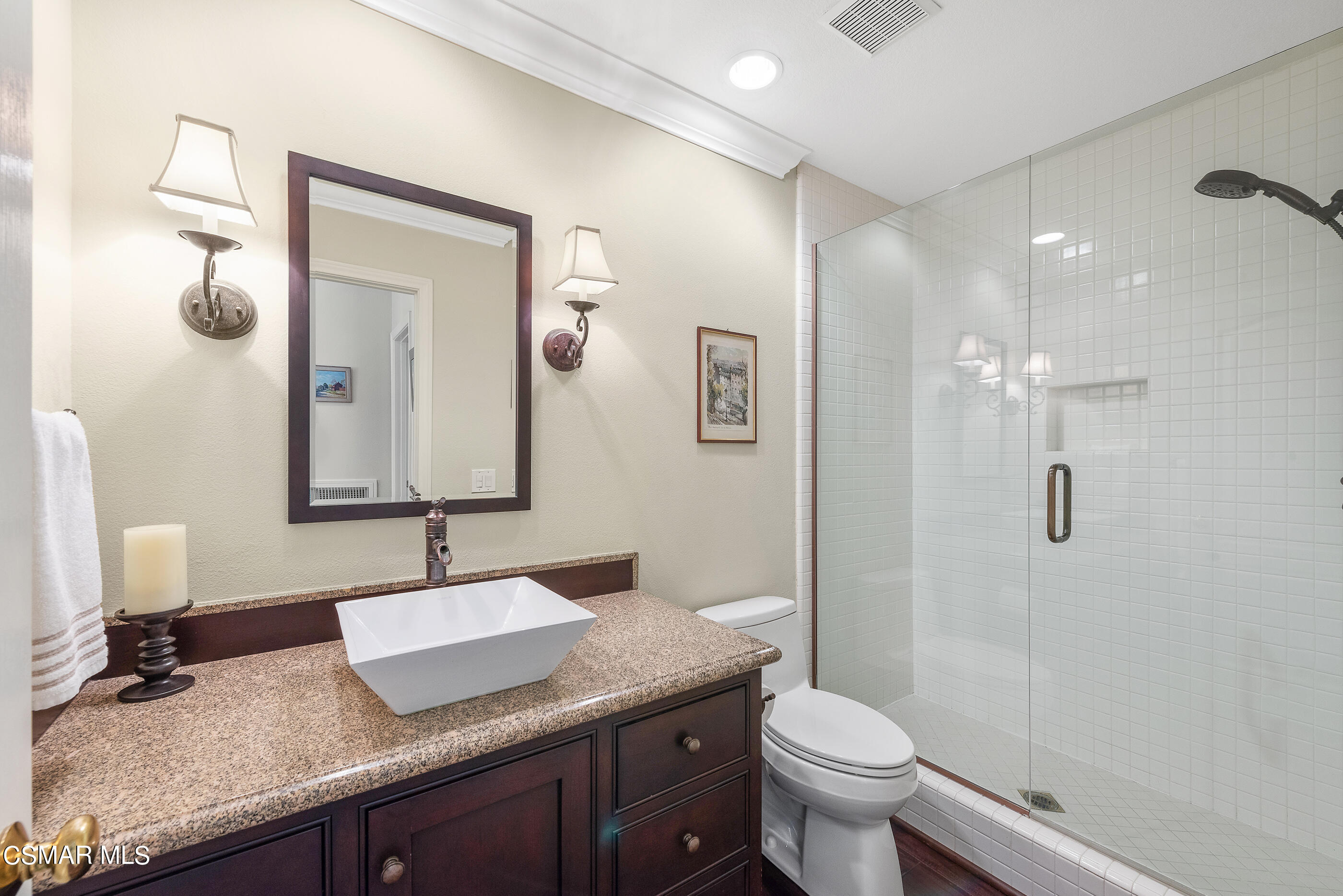 3019 Shadow Hill Circle Thousand Oaks, CA 91360 - Photo 14 of 30 a bathroom with a granite countertop sink a toilet and a mirror