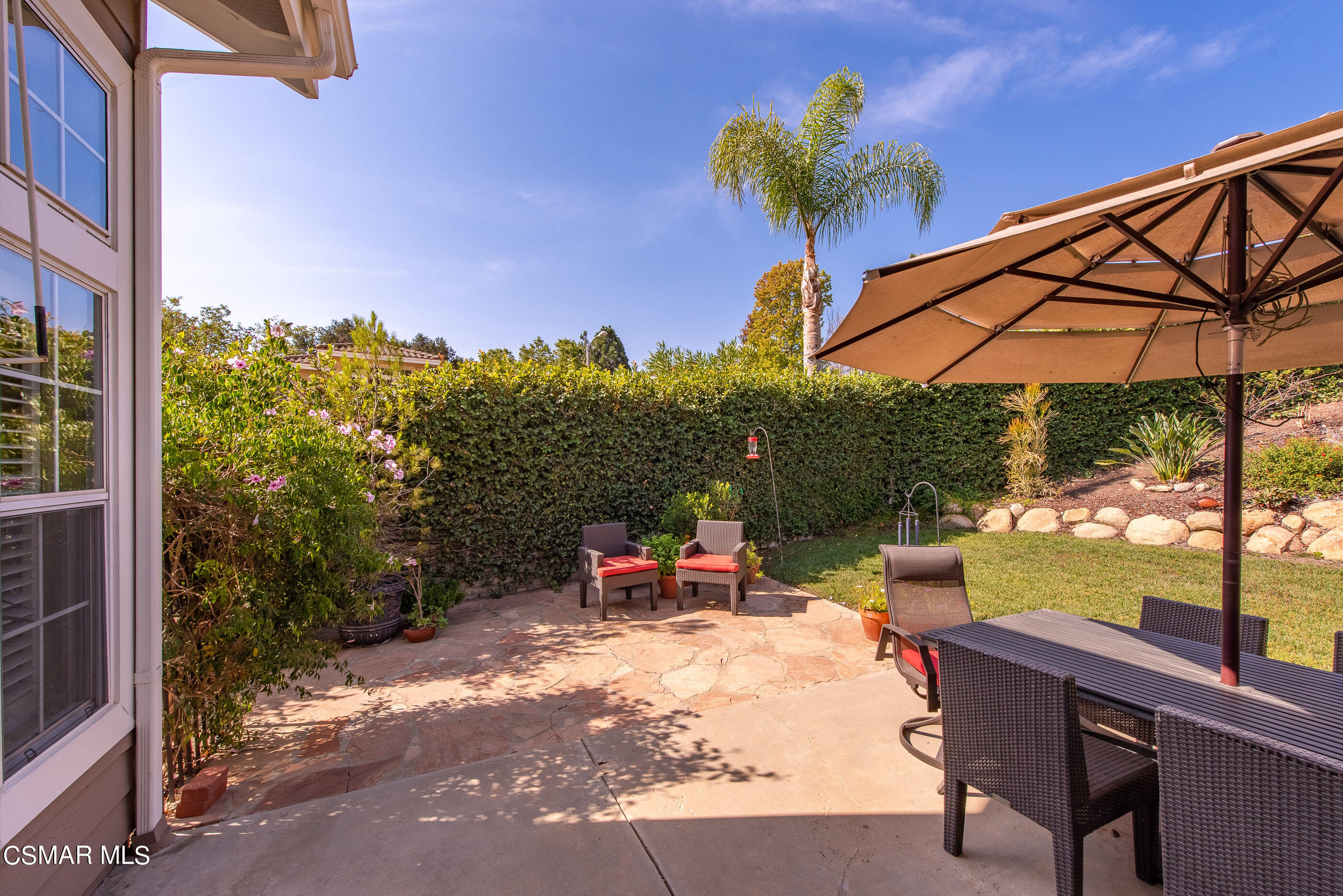 3019 Shadow Hill Circle Thousand Oaks, CA 91360 - Photo 26 of 30 a backyard of a house with table and chairs