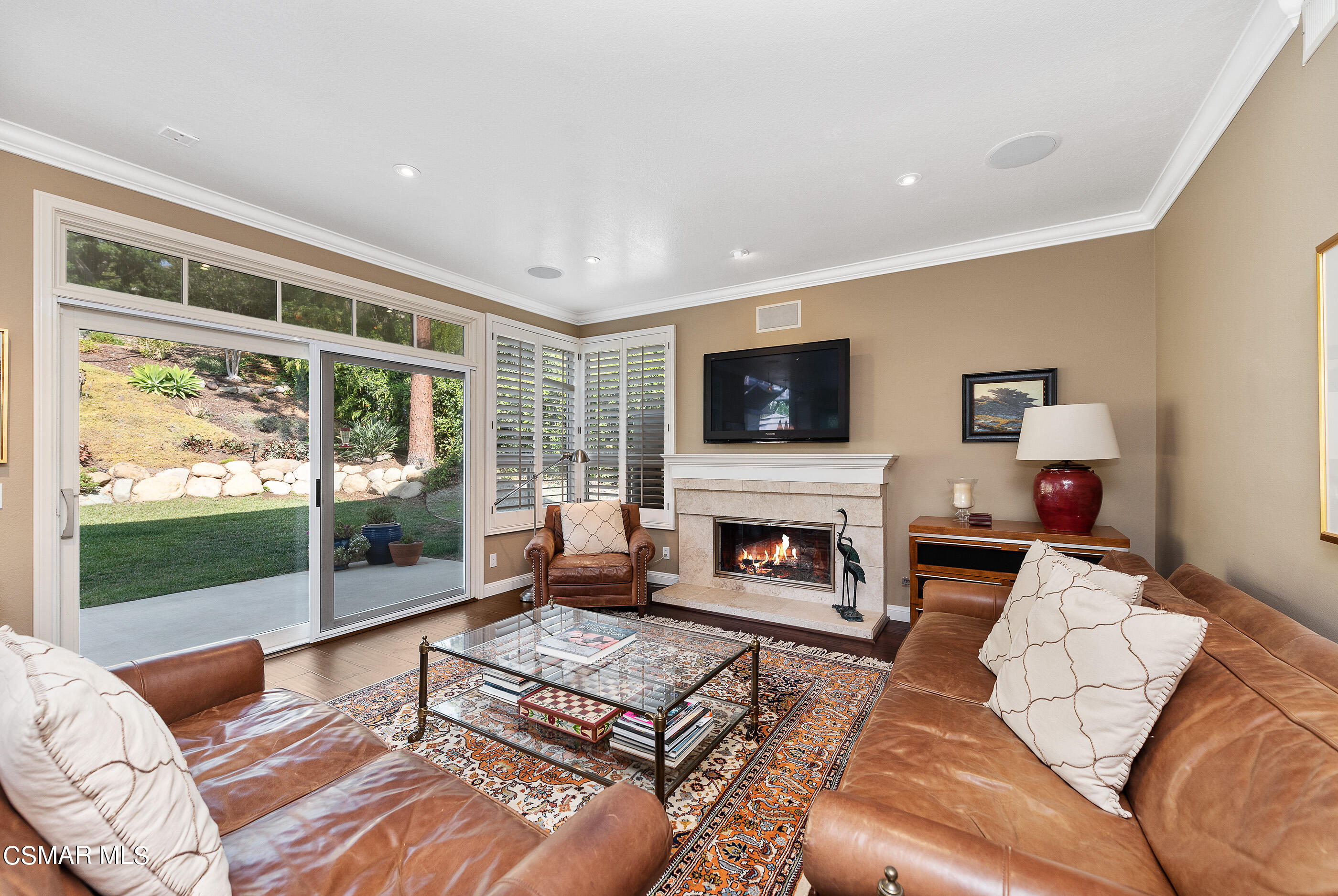 3019 Shadow Hill Circle Thousand Oaks, CA 91360 - Photo 3 of 30 a living room with furniture a flat screen tv and a fireplace
