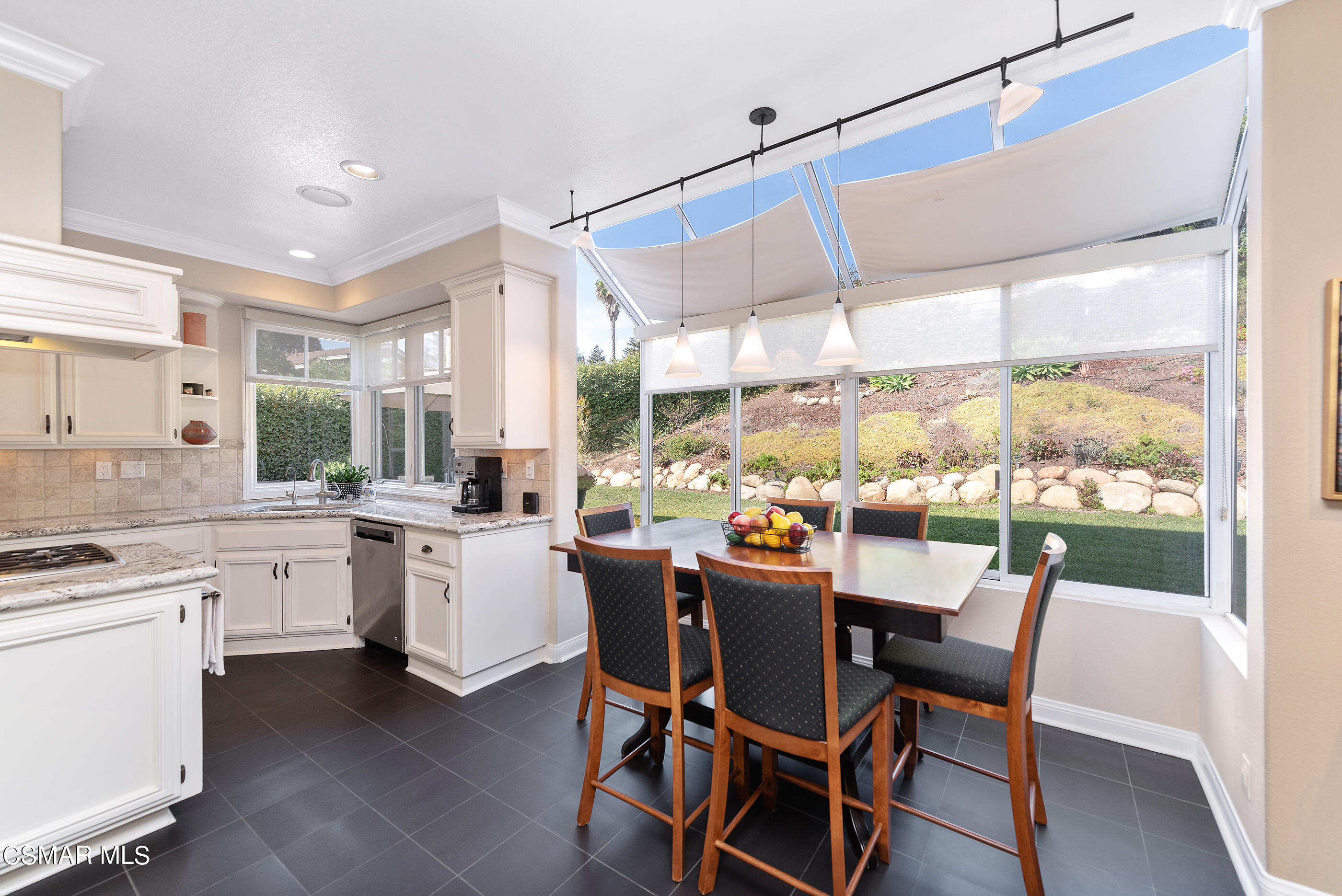 3019 Shadow Hill Circle Thousand Oaks, CA 91360 - Photo 7 of 30 a dining room with wooden floor a sink and a floor to ceiling window