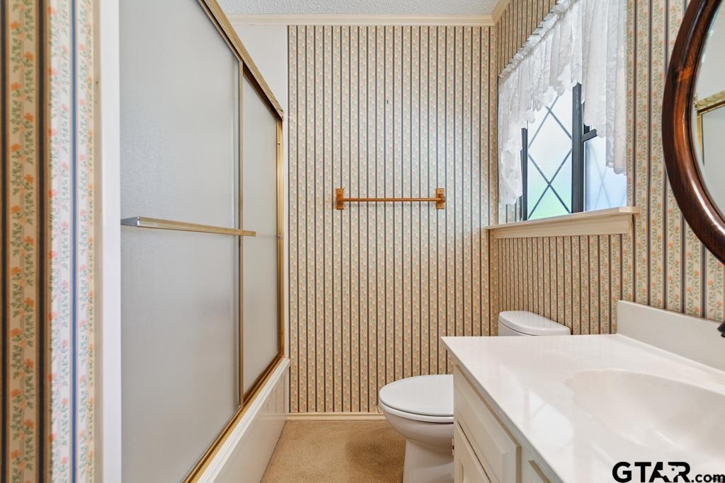 227 Brookside Drive Hideaway, TX 75771 - Photo 23 of 35 a bathroom with a sink toilet and shower