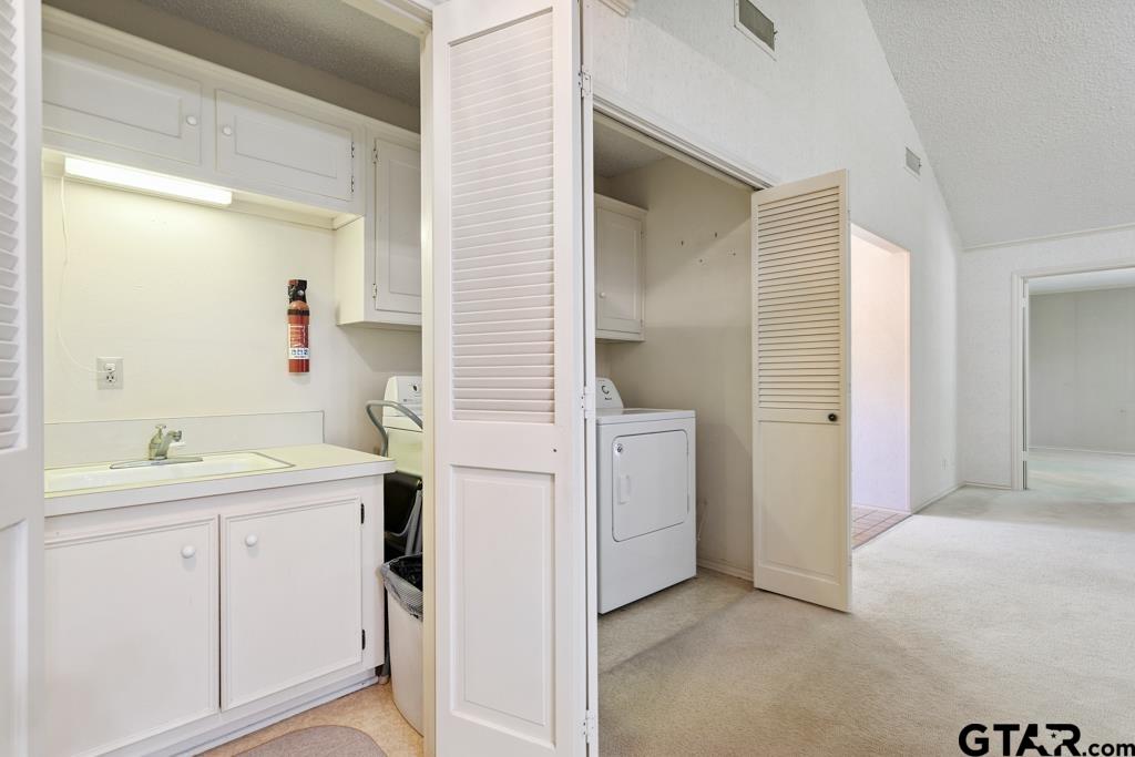 227 Brookside Drive Hideaway, TX 75771 - Photo 7 of 35 a view of a bathroom with a sink and a mirror