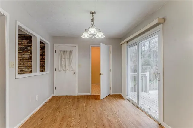 a view of a kitchen with a sink and microwave