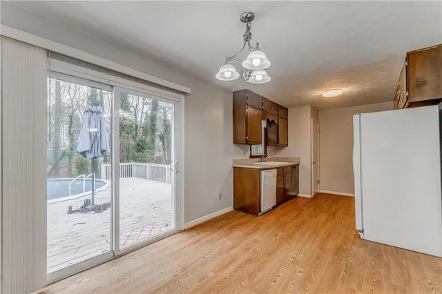 a kitchen with a stove and a refrigerator