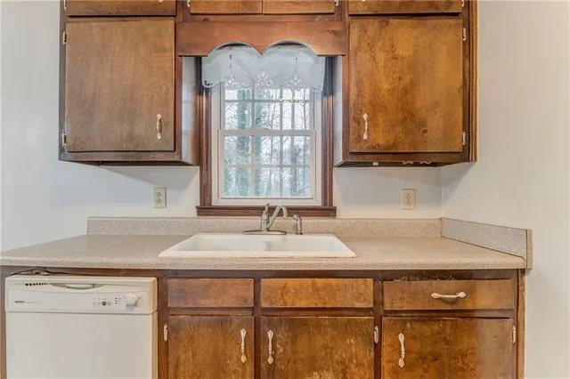 a kitchen with stainless steel appliances a refrigerator and a stove top oven