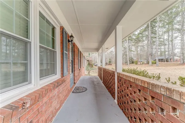 a view of an empty room with a fireplace