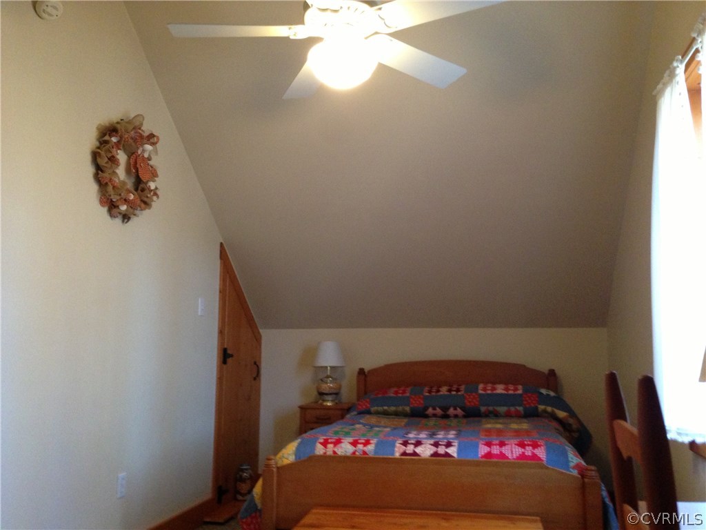 2309 Mt Pleasant Road Pamplin, VA 23958 - Photo 9 of 16 a room with a fireplace and a chandelier