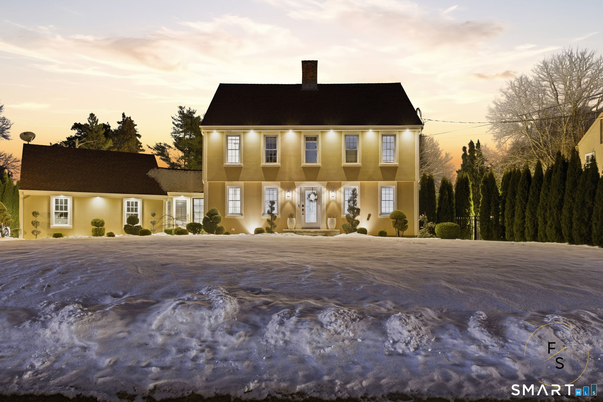 a front view of a house with a yard