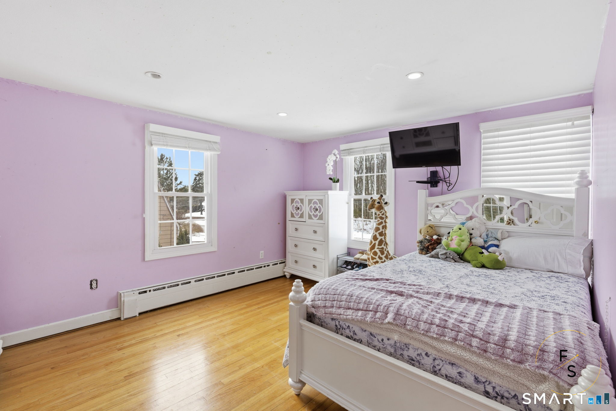 508 Highland Street Wethersfield, CT 06109 - Photo 18 of 39 a bedroom with a bed and a flat screen tv