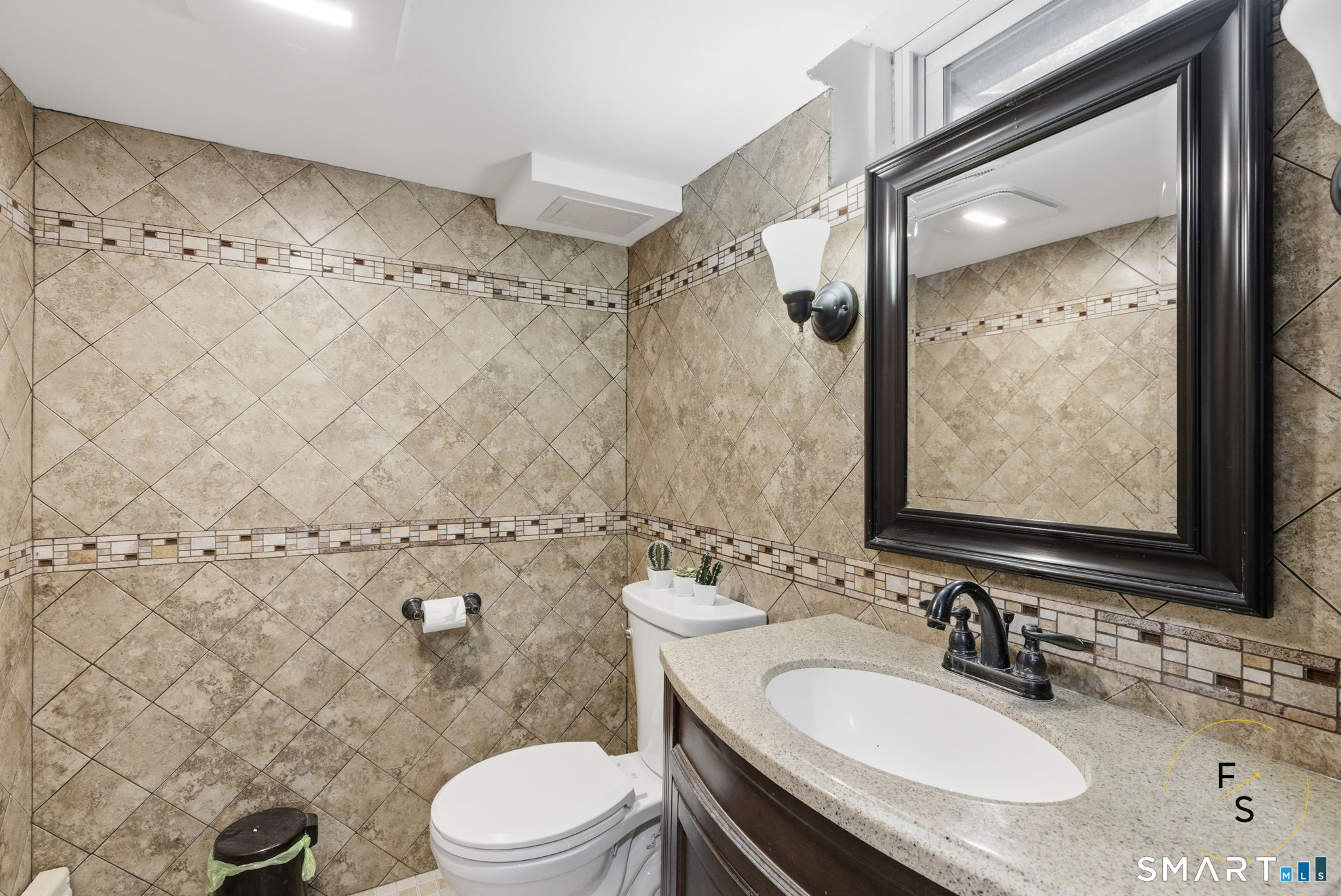 508 Highland Street Wethersfield, CT 06109 - Photo 20 of 39 a bathroom with a sink toilet vanity and shower