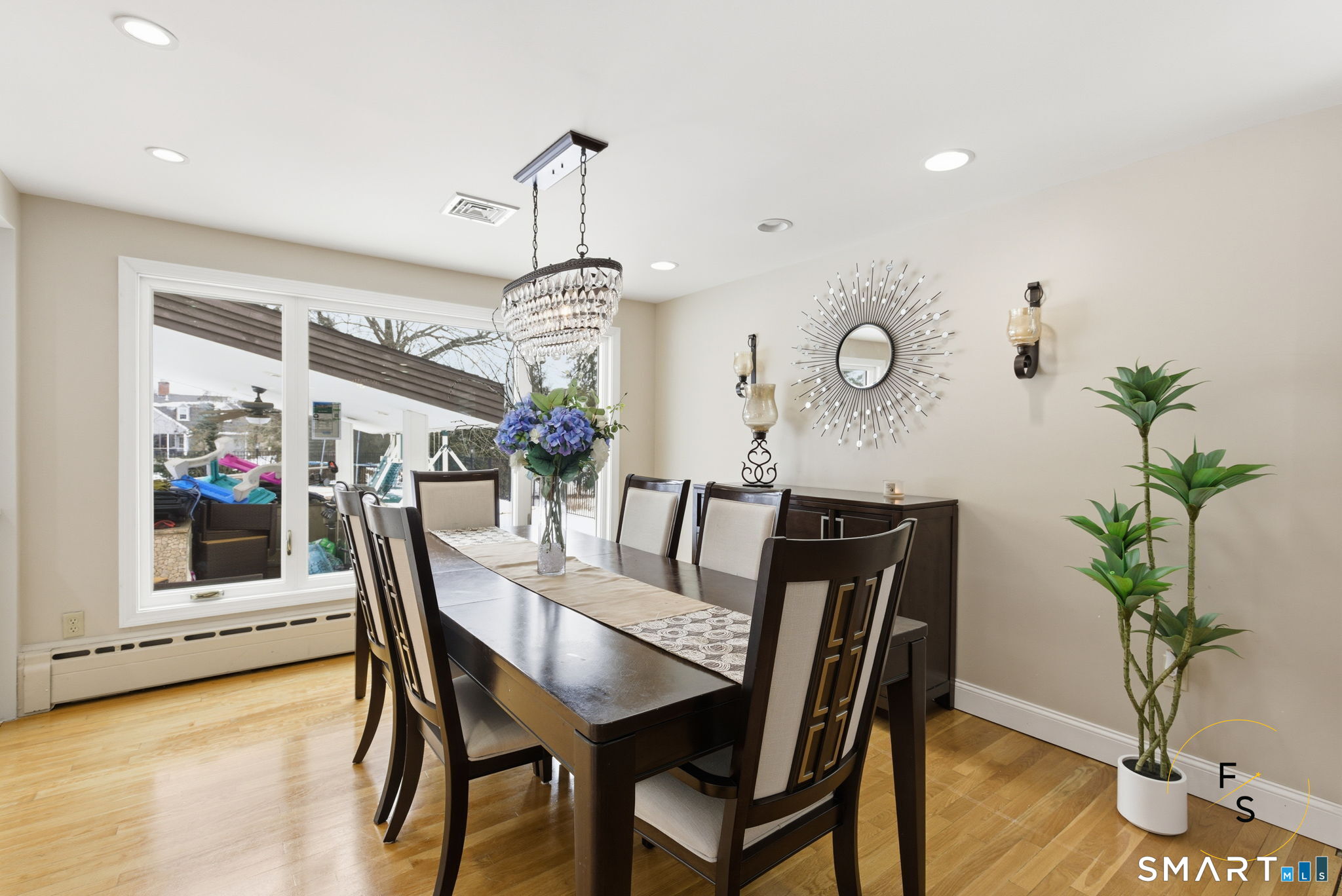 508 Highland Street Wethersfield, CT 06109 - Photo 7 of 39 a view of a dining room with furniture and wooden floor