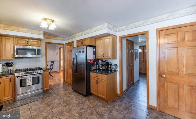 a kitchen with lots of counter top space and a sink