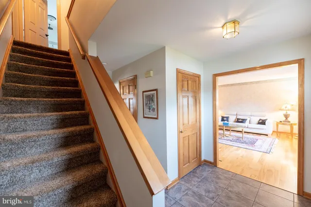 a bedroom with furniture and a wooden floor
