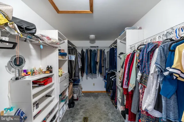 a bedroom with a bed and a chair