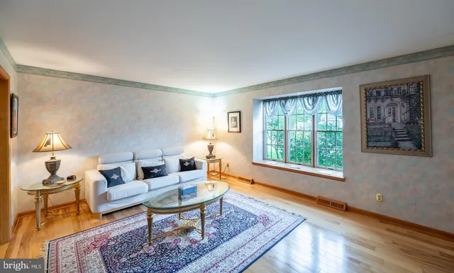 a living room with furniture and a rug