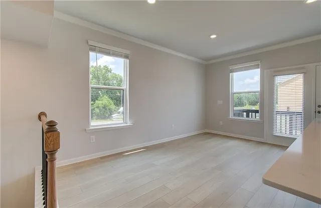 a view of an empty room with a window