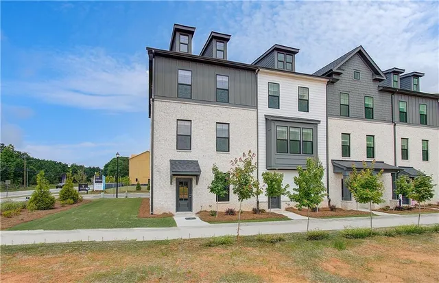 a front view of a house with a yard